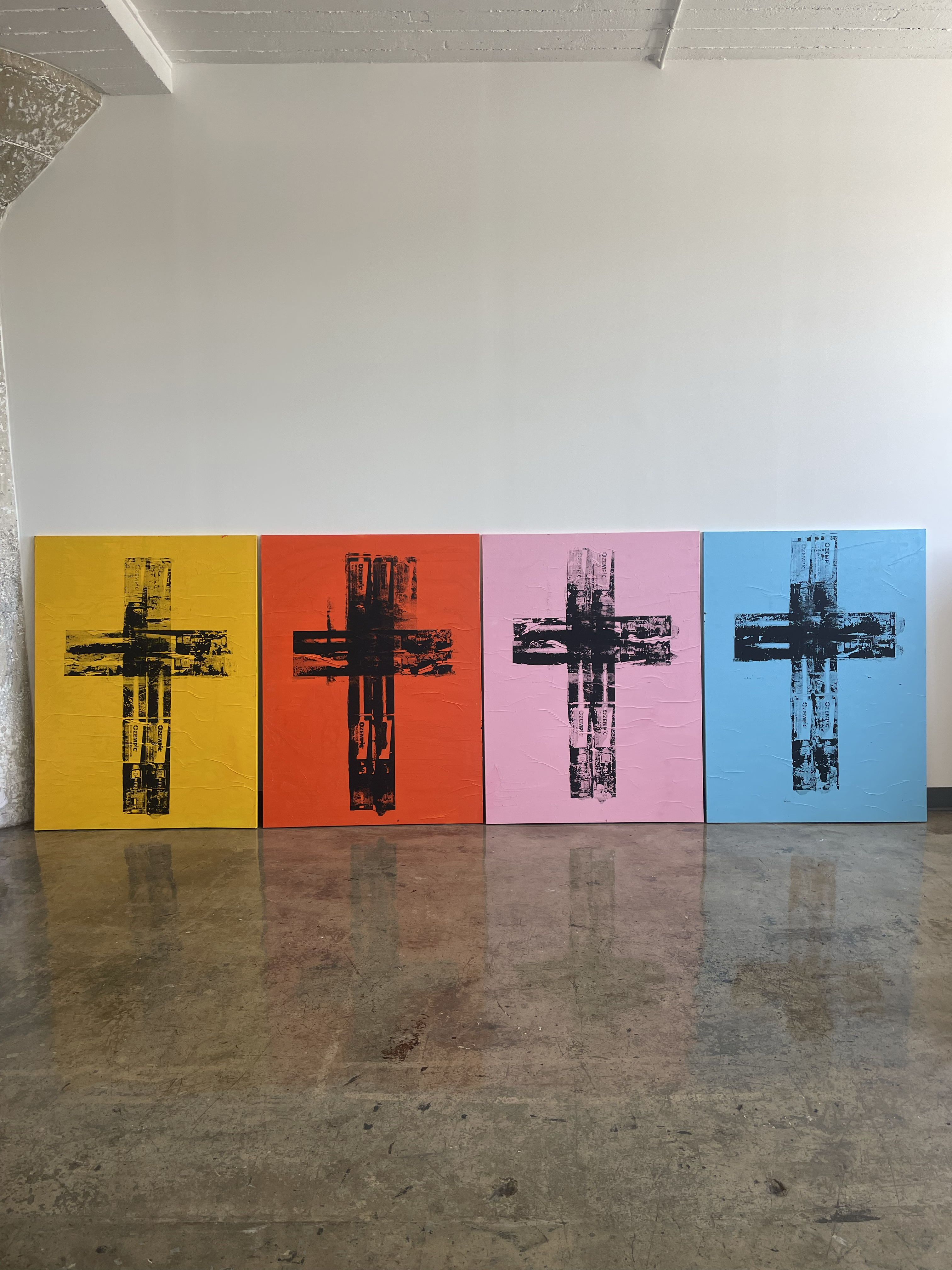 Four Matt Adam Ozempic cross paintings in yellow, orange, pink and blue